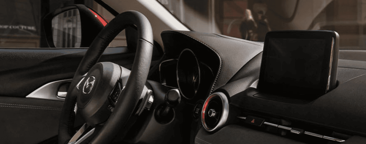 Dashboard and steering wheel Mazda side view